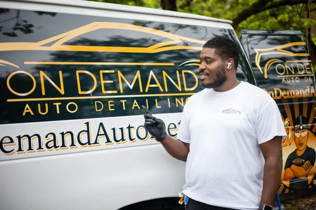 a man pointing out On Demand Auto Detail LLC logo