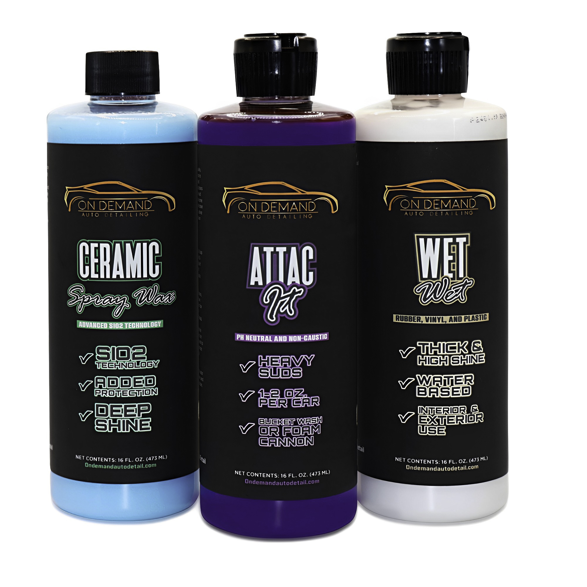 Three bottles of On Demand Auto Solutions products: Ceramic Spray Wax (blue liquid), ATTAC It! Heavy Suds (purple liquid), and Wet Wet for rubber, vinyl, and plastic (black liquid), standing upright side by side.